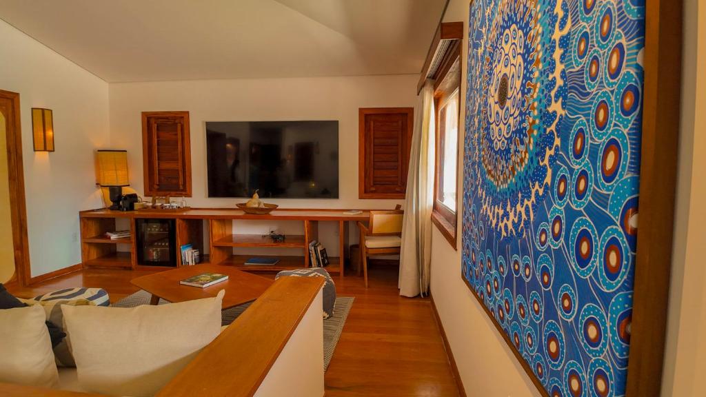 TV a/nebo společenská místnost v ubytování Vila Selvagem Hotel Contemporaneo