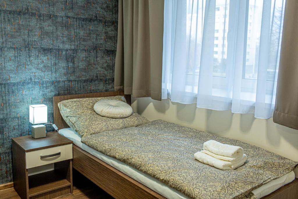 Postel nebo postele na pokoji v ubytování Penzión LABA