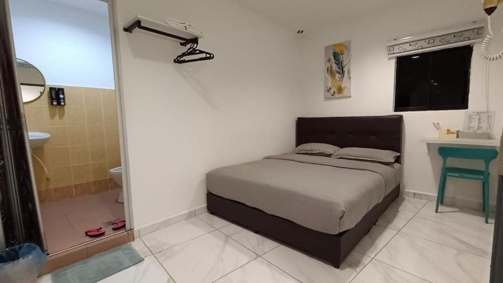 Postel nebo postele na pokoji v ubytování MUSANG ONG HOTEL