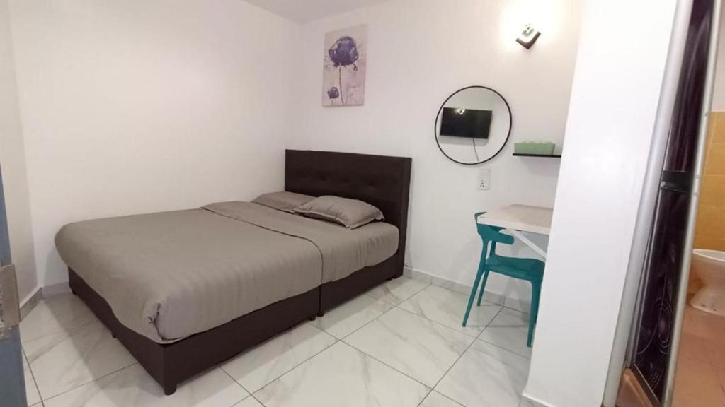 Postel nebo postele na pokoji v ubytování MUSANG ONG HOTEL