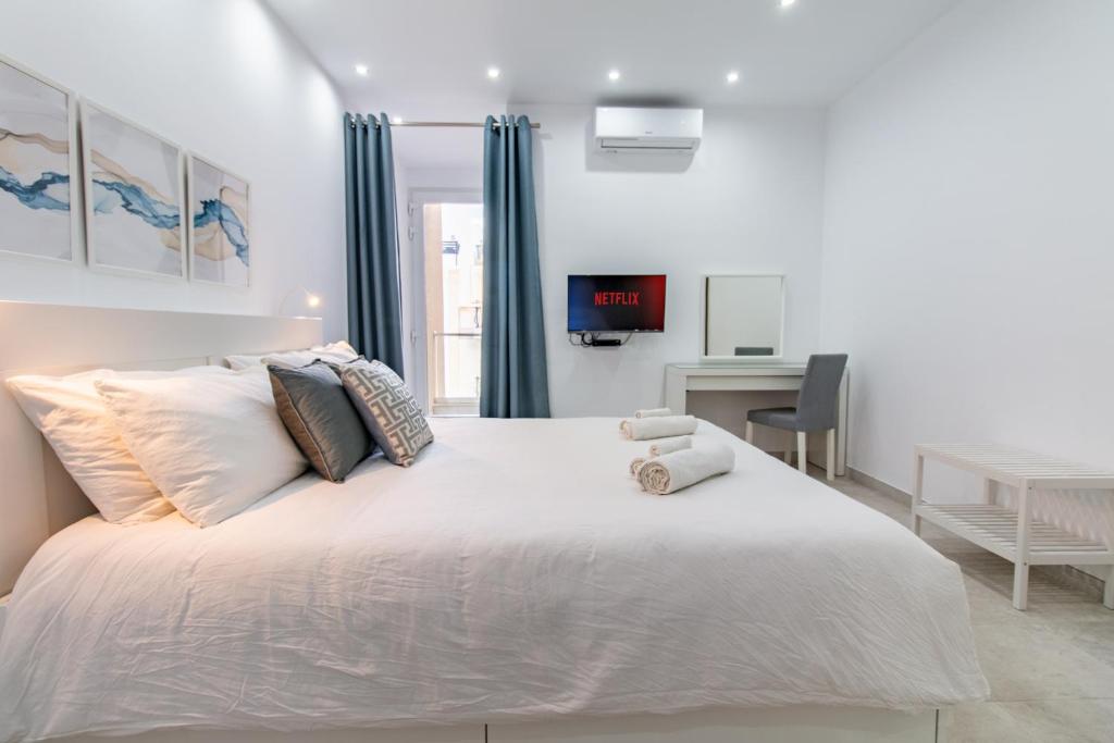 Postel nebo postele na pokoji v ubytování Sandstone Apartment 19
