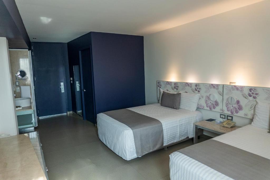 Postel nebo postele na pokoji v ubytování Hotel Punta Azul