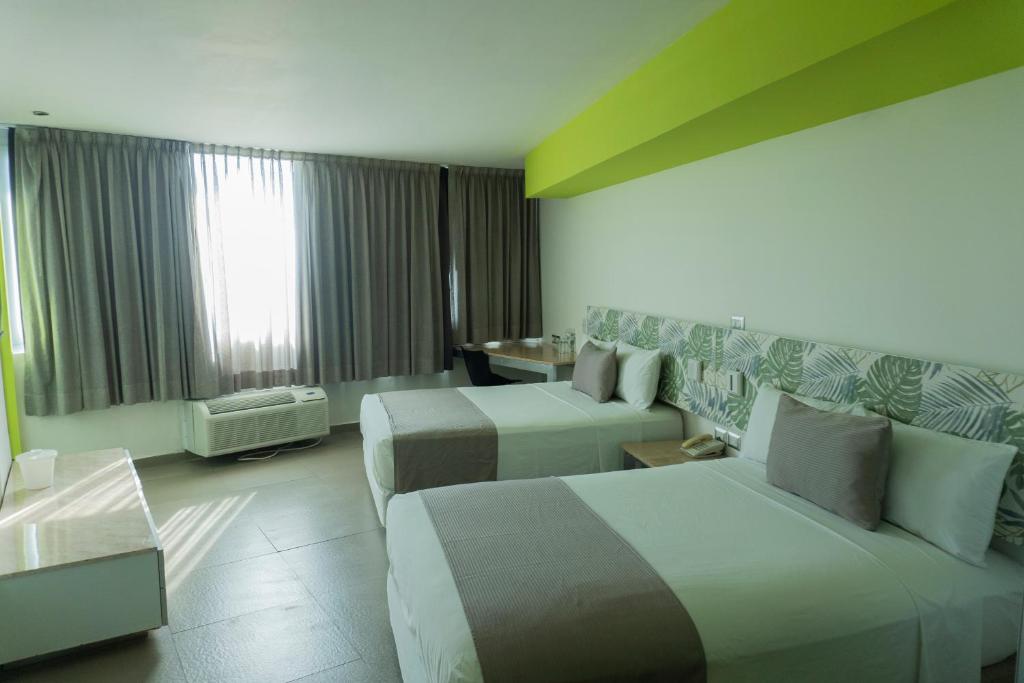 Postel nebo postele na pokoji v ubytování Hotel Punta Azul