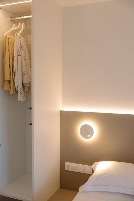 A bed or beds in a room at Myrto Homes Lefkada Agios Nikitas Greece