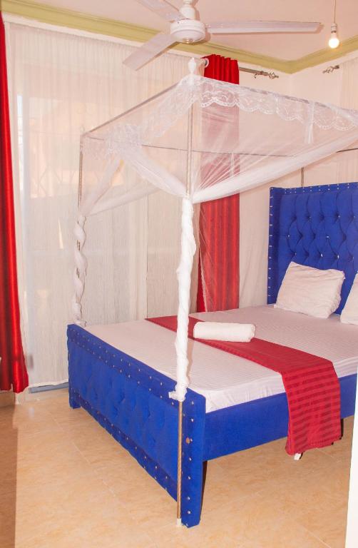 Postel nebo postele na pokoji v ubytování Bamburi Luxury Homes One bedroom apartment