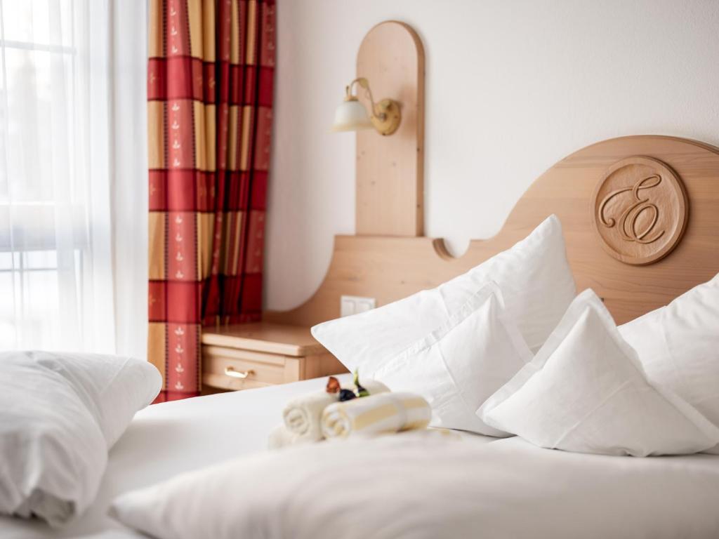 Postel nebo postele na pokoji v ubytování Hotel Garni Europa