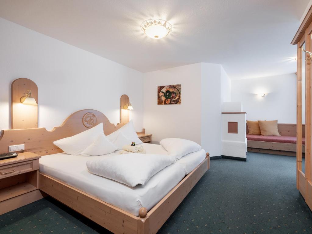 Postel nebo postele na pokoji v ubytování Hotel Garni Europa