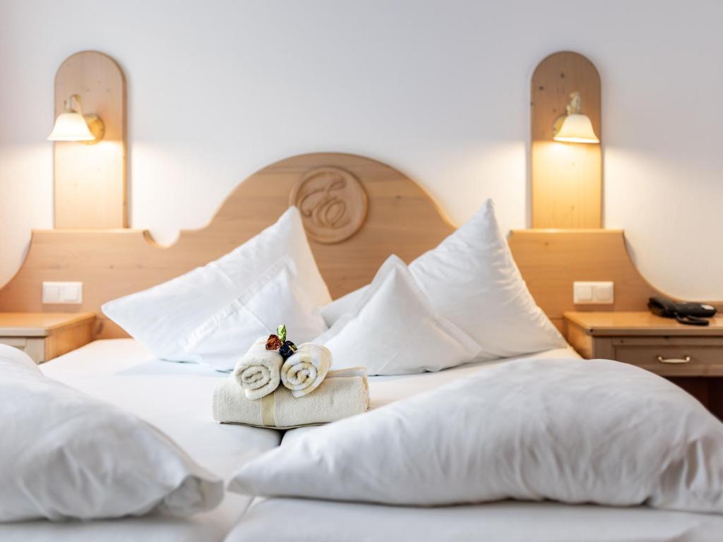 Postel nebo postele na pokoji v ubytování Hotel Garni Europa