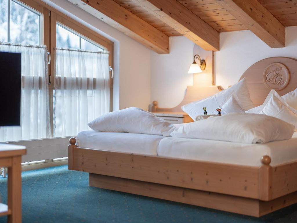 Postel nebo postele na pokoji v ubytování Hotel Garni Europa