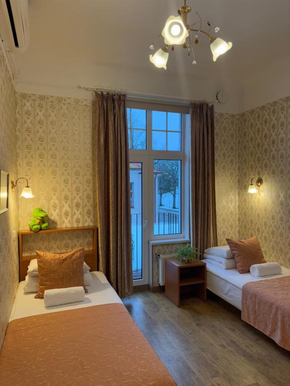 Postel nebo postele na pokoji v ubytování Green Villa