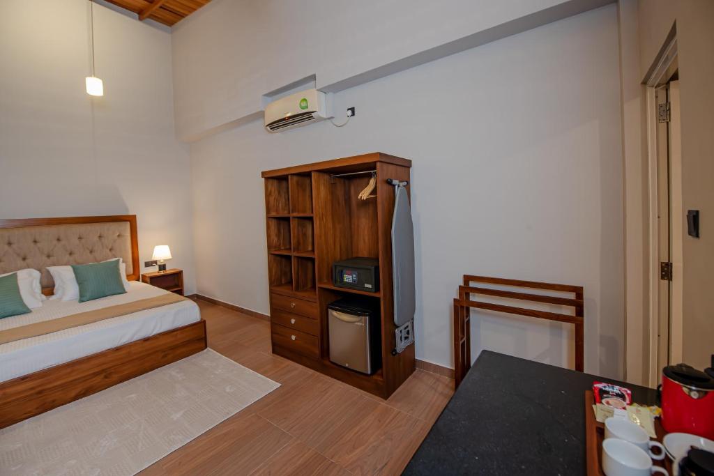 Postel nebo postele na pokoji v ubytování Ivory Resort Dikwella