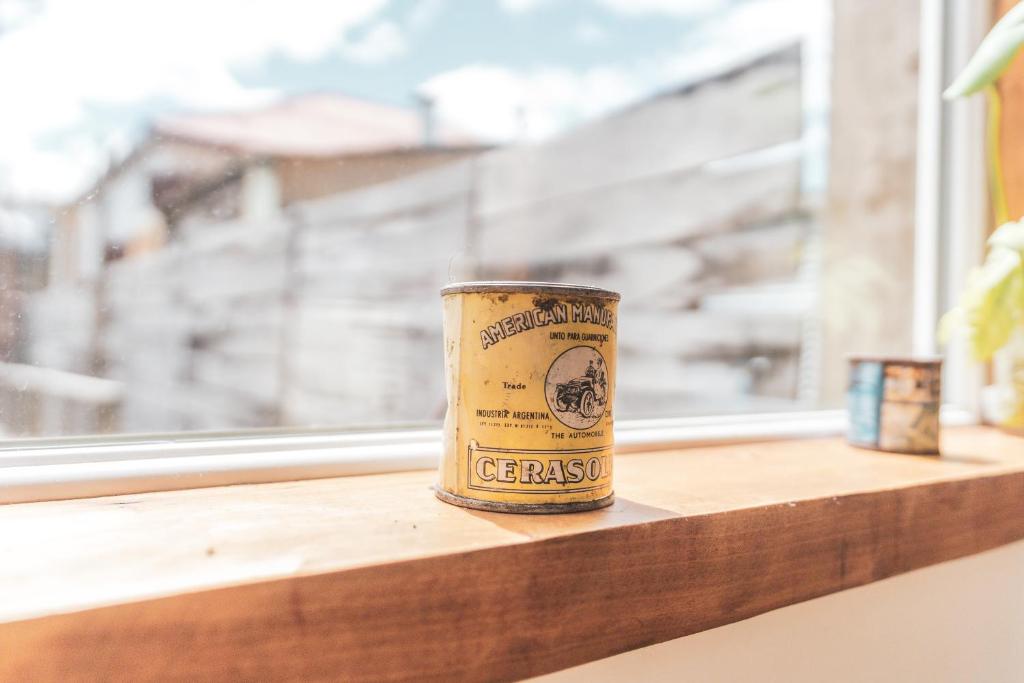 a can of beer sitting on a window sill at Pristine Patagonia Hotel in Puerto Natales