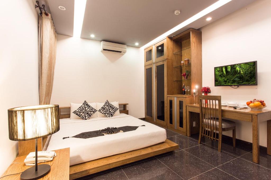 Giường trong phòng chung tại Valentine Hotel