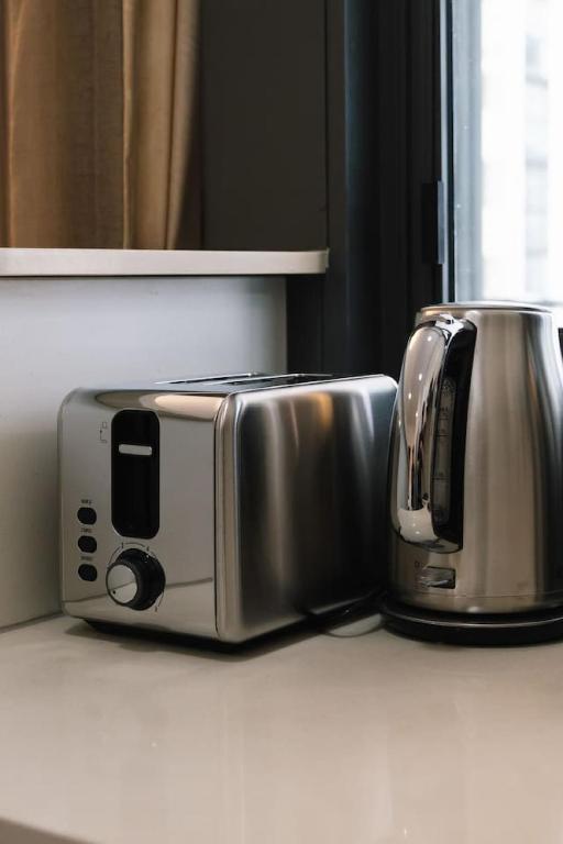 two toasters sitting on a counter in a kitchen at Best Value 2Beds Apt at CBD with Pool Gym Carpark in Brisbane
