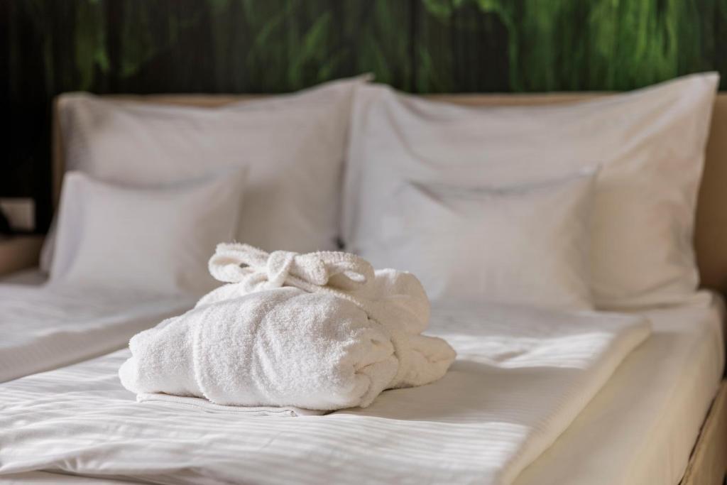 Postel nebo postele na pokoji v ubytování Hotel Atlantis Wellness & Conference