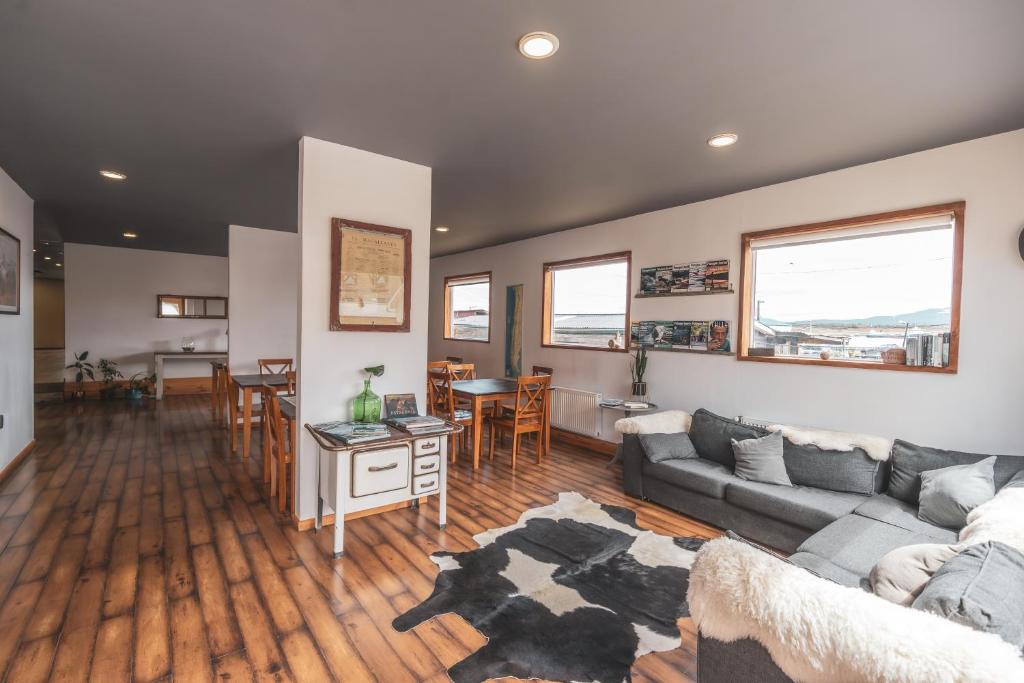 a living room with a couch and a table at Pristine Patagonia Hotel in Puerto Natales