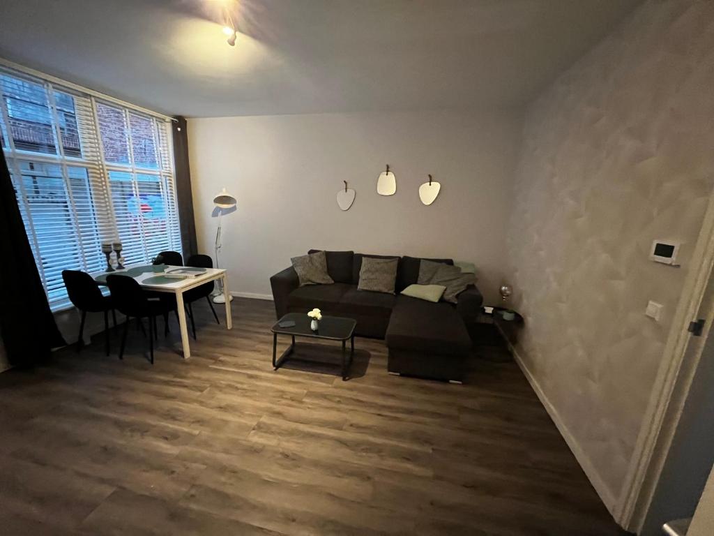 a living room with a couch and a table at Poelgeeststraat in Leiden