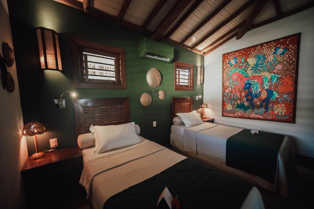 Postel nebo postele na pokoji v ubytování Vila Selvagem Hotel Contemporaneo