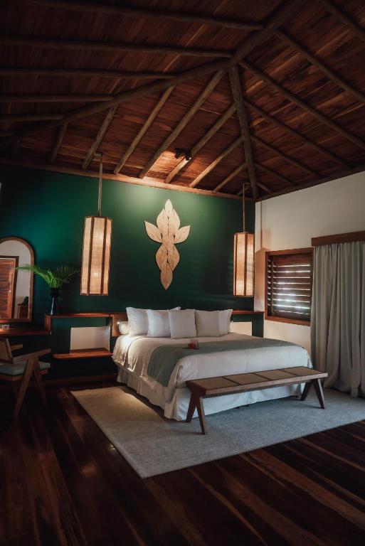 Postel nebo postele na pokoji v ubytování Vila Selvagem Hotel Contemporaneo