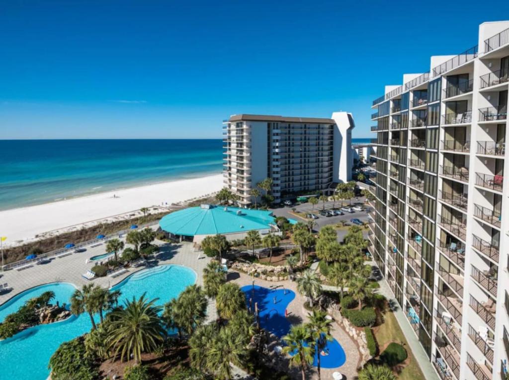 an aerial view of the hotel and the beach at Edgewater Golf Villa 1210 in Panama City Beach