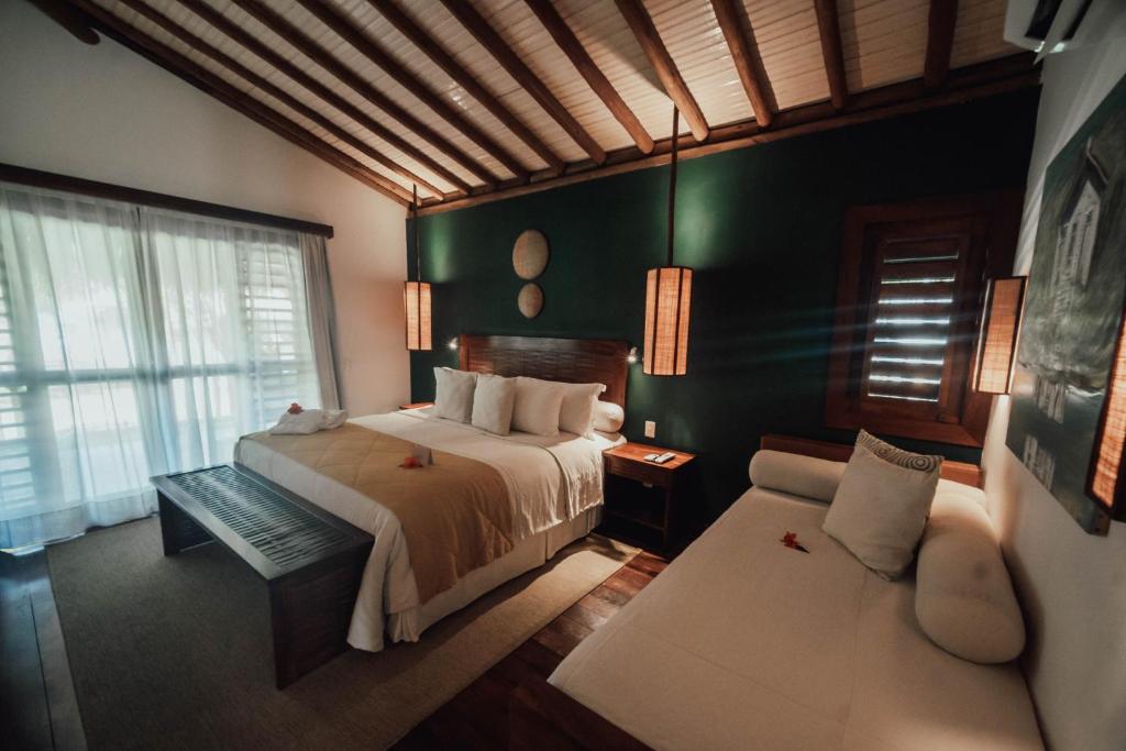 Postel nebo postele na pokoji v ubytování Vila Selvagem Hotel Contemporaneo