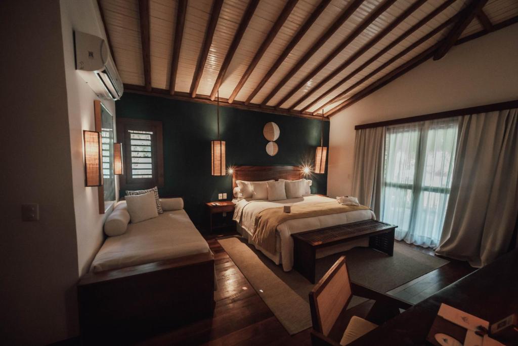 Postel nebo postele na pokoji v ubytování Vila Selvagem Hotel Contemporaneo