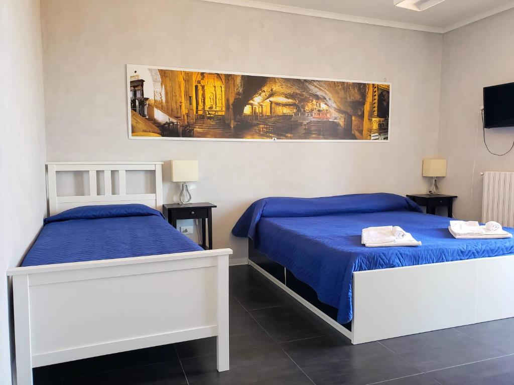 Postel nebo postele na pokoji v ubytování Rooms Gli Arcangeli - Affitti Brevi Italia