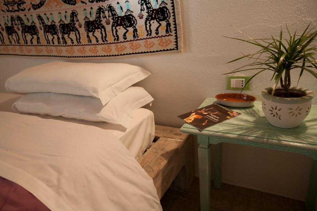 Postel nebo postele na pokoji v ubytování B&B Stentadì