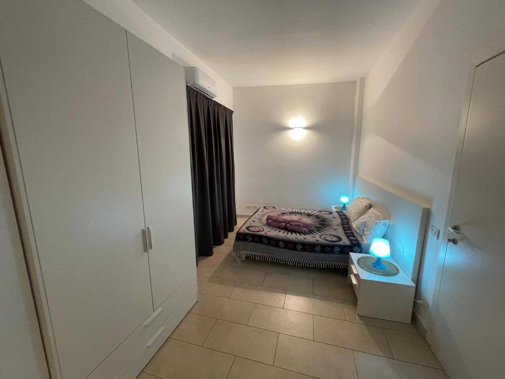 Cama ou camas em um quarto em Alla Scala colorata