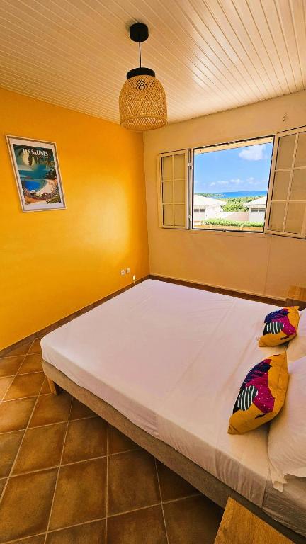 Letto o letti in una camera di La villa SunCloud