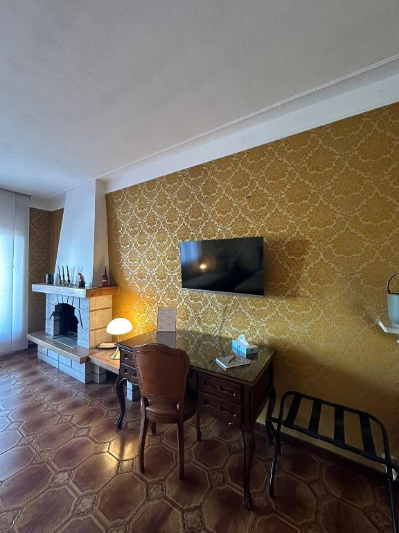 TV a/nebo společenská místnost v ubytování Casa di Martina
