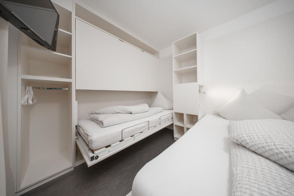 Posteľ alebo postele v izbe v ubytovaní Apart Benedikt