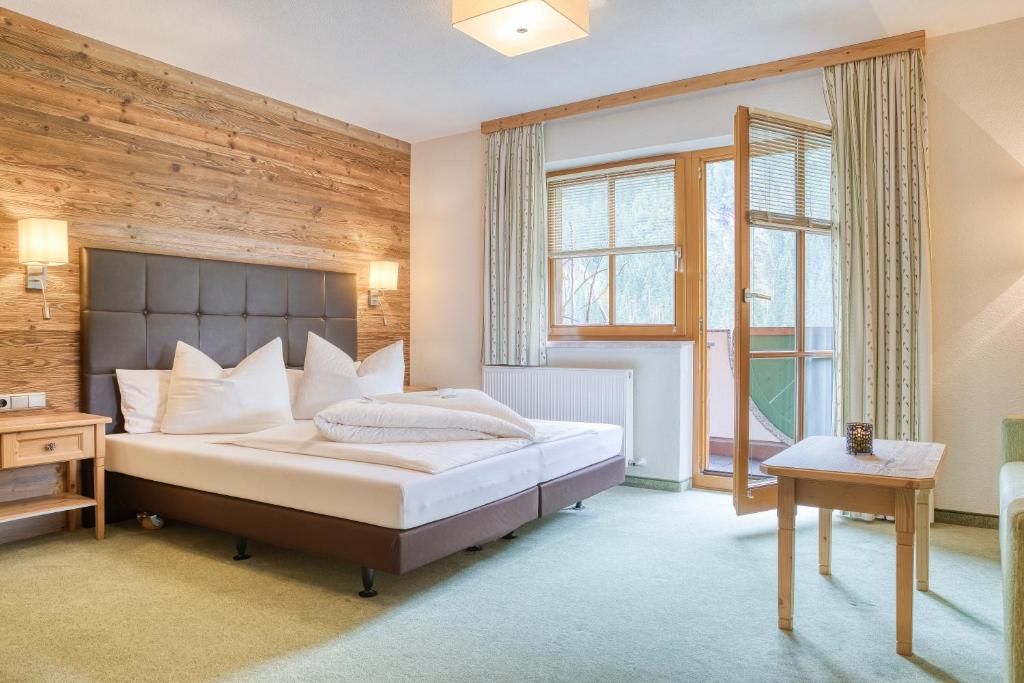 Voodi või voodid majutusasutuse Hotel Edelweiß-Schlössl toas