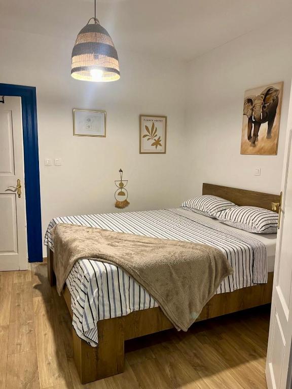 a bedroom with a large bed in a room at Collie’s place in Koper