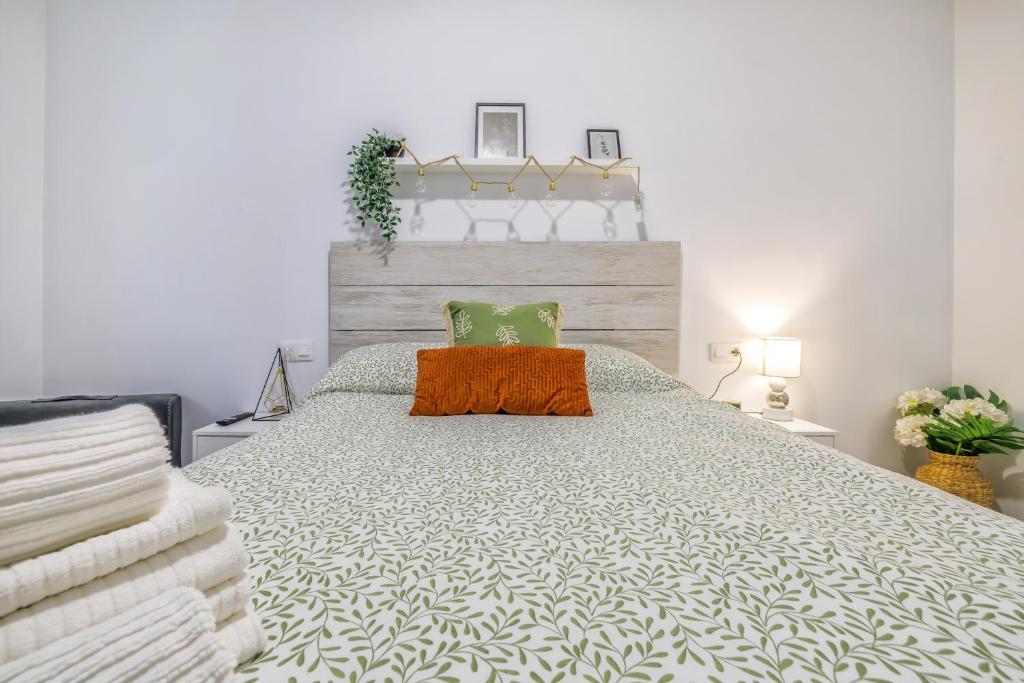 En eller flere senge i et værelse på Aires de Azahar & Parking Incluido