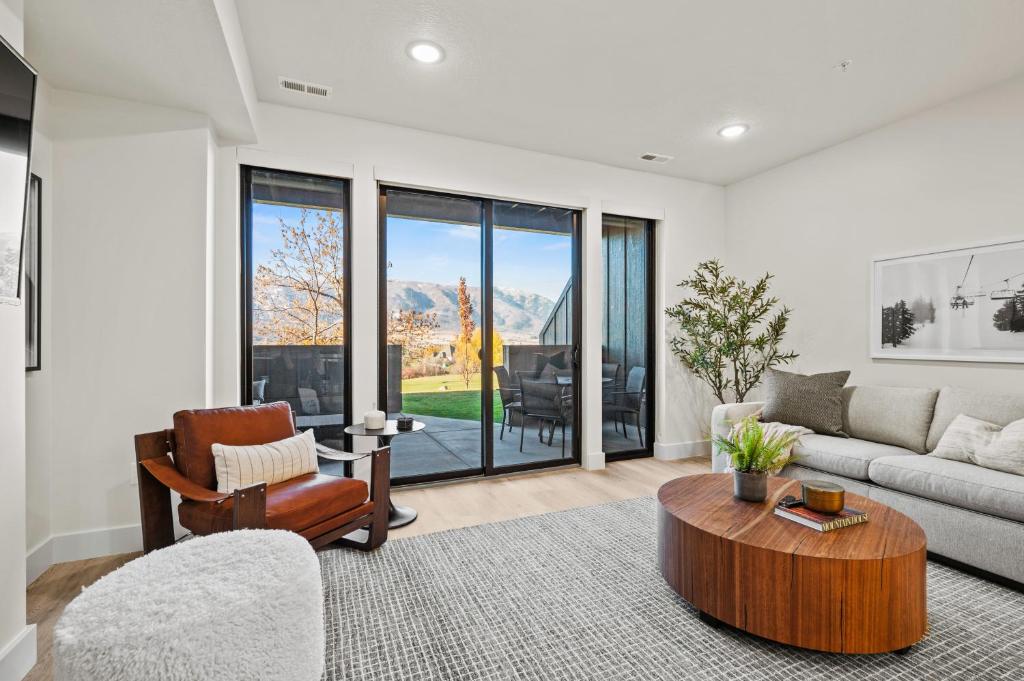 a living room with a couch and a table at Alpine Retreat at the Pointe Pt A106 in Eden