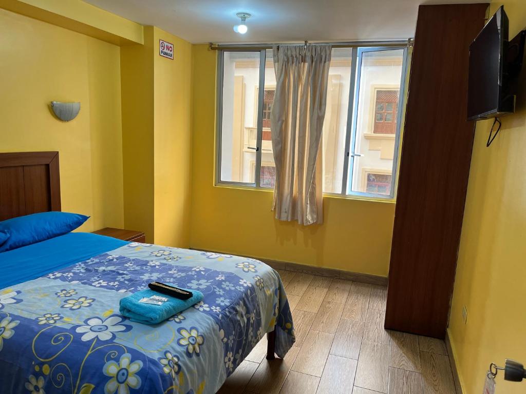 Postel nebo postele na pokoji v ubytování Hotel Residencial Miraflores