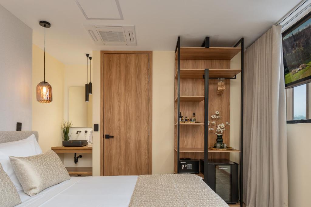 Postel nebo postele na pokoji v ubytování LIN Boutique Hotel by HOUSY HOST