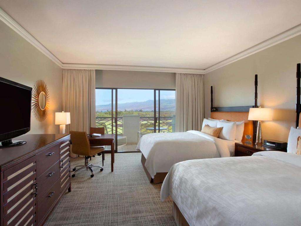 Postel nebo postele na pokoji v ubytování Fairmont Orchid