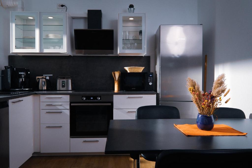 Kuchyň nebo kuchyňský kout v ubytování Apartment 4