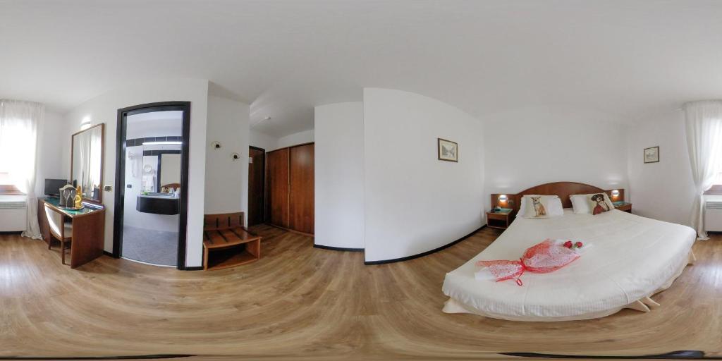 Postel nebo postele na pokoji v ubytování Hotel Daunia