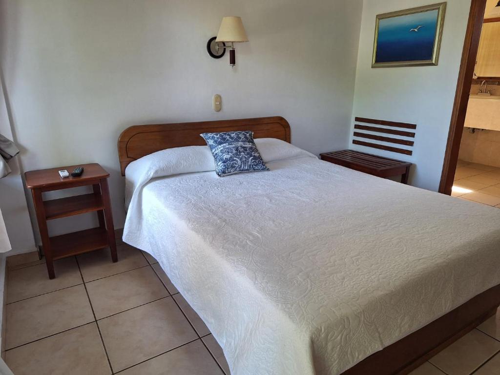 Postel nebo postele na pokoji v ubytování Hotel Playa Bonita Tela