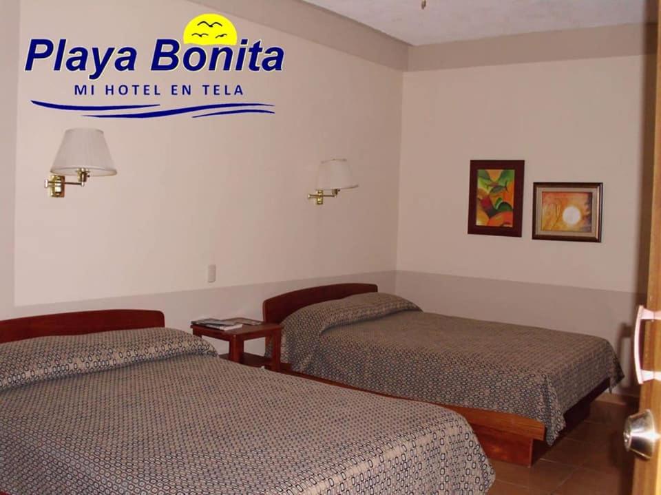 Postel nebo postele na pokoji v ubytování Hotel Playa Bonita Tela