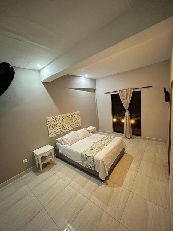 Postel nebo postele na pokoji v ubytování Hotel el Ancla Campestre