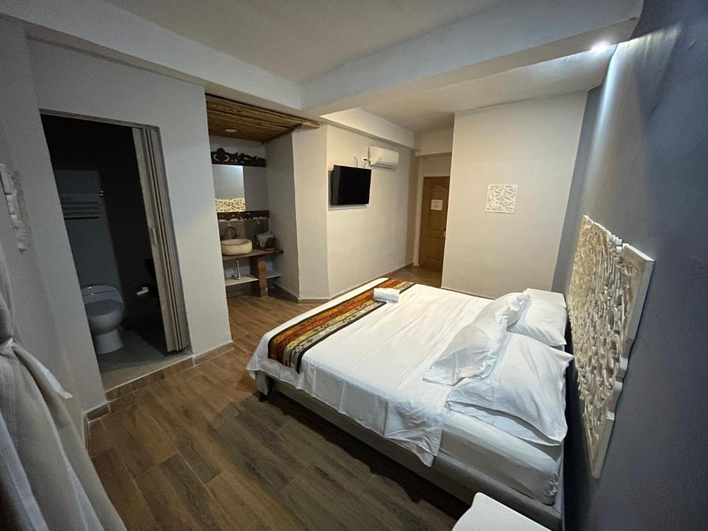 Postel nebo postele na pokoji v ubytování Hotel el Ancla Campestre