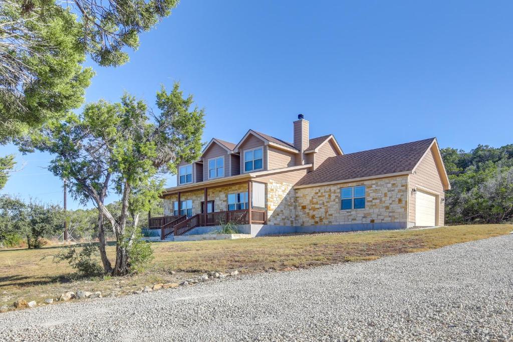 a house on a hill with a driveway at Scenic Views, Fire Pit Texas Hill Country Getaway in Fischer