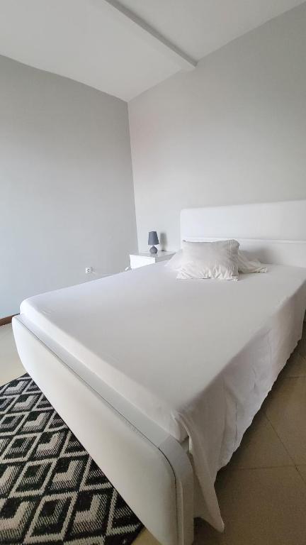 Postel nebo postele na pokoji v ubytování Praia Guest House