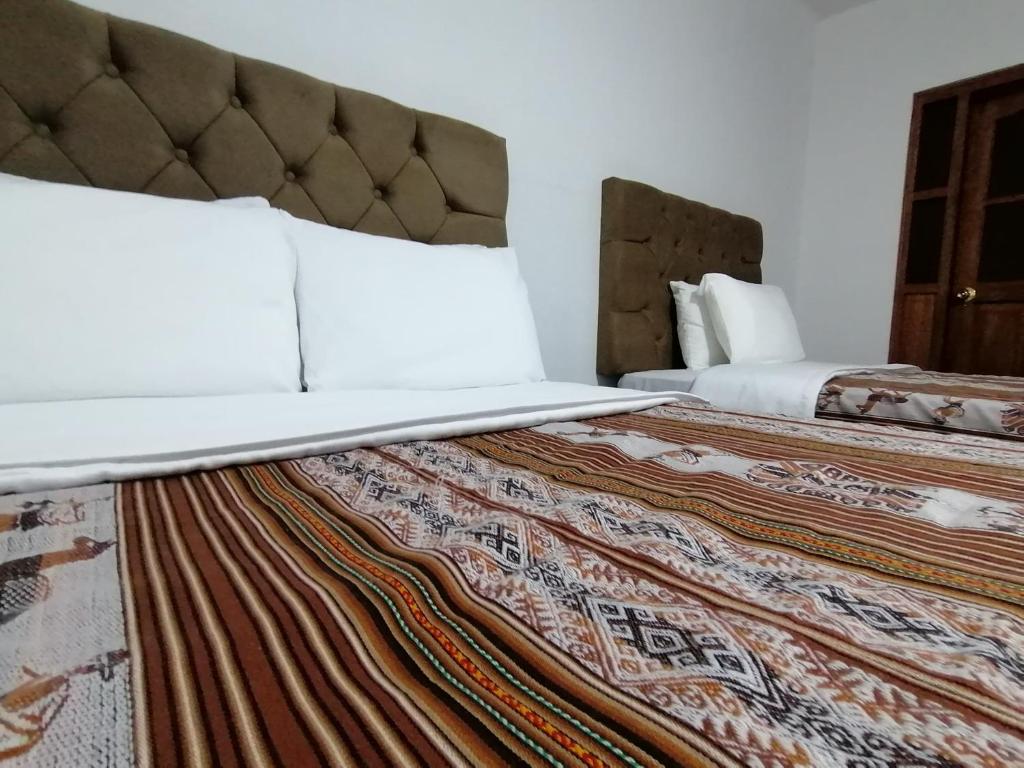 Postel nebo postele na pokoji v ubytování Mama Simona