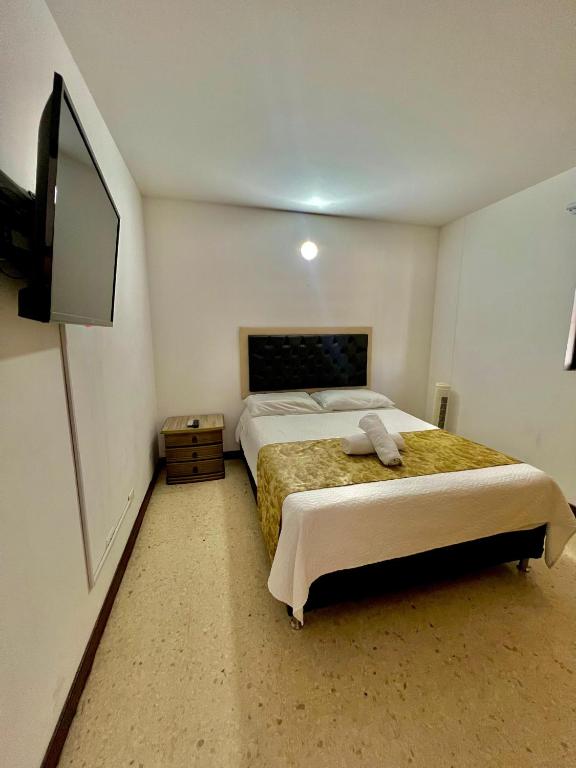 Postel nebo postele na pokoji v ubytování Hotel Torre Primavera