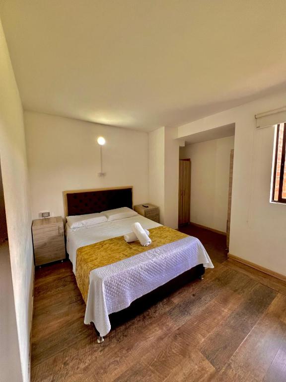 Postel nebo postele na pokoji v ubytování Hotel Torre Primavera